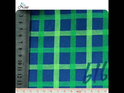 Fabric with a plaid pattern in shades of blue and green